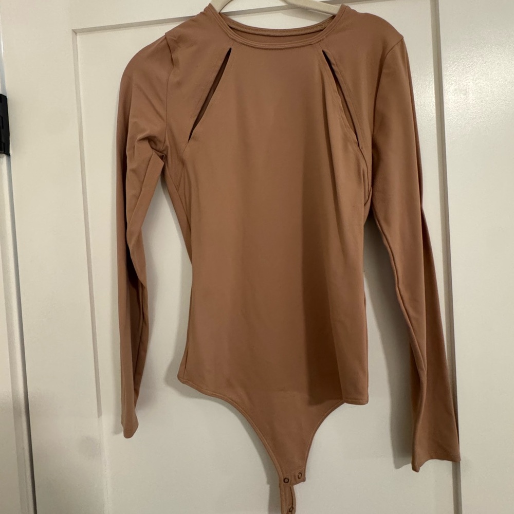 Tan long sleeve bodysuit with decorative slits